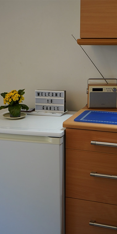 A warm welcome to Gable Cottage, with fresh flowers and the radio ready to tune into quiet moments