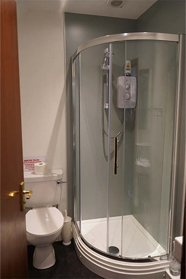 Bright, spotless shower room — simple, modern, and just what you need to refresh and reset